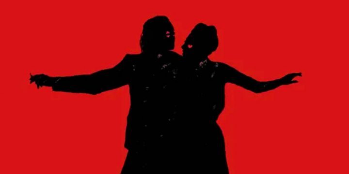 arthur-fleck-and-harley-quinn-silhouettes-dancing-on-a-red-background